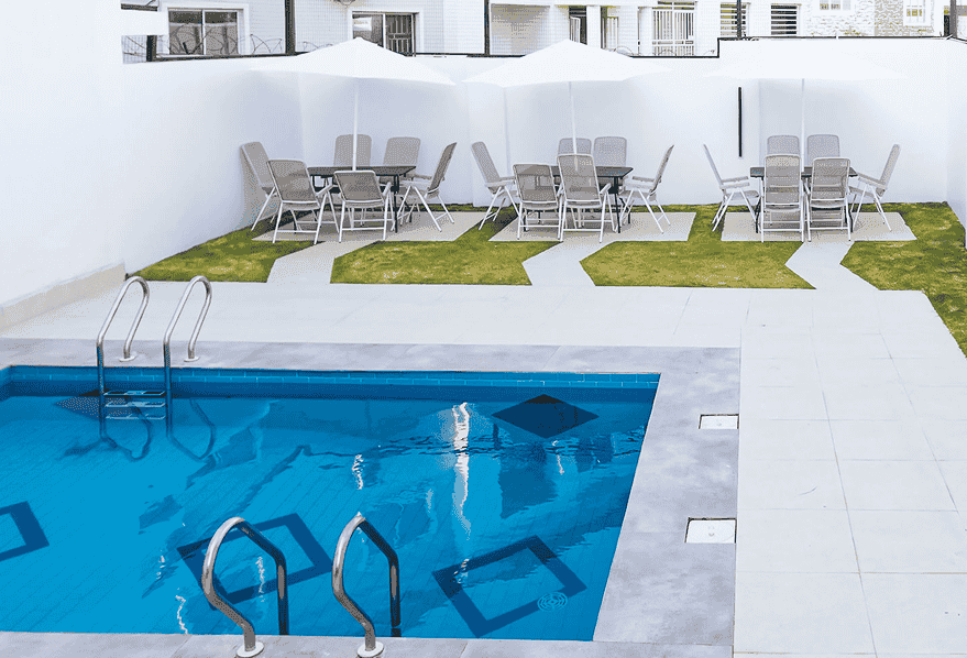 Outdoor swimming pool with lounge chairs