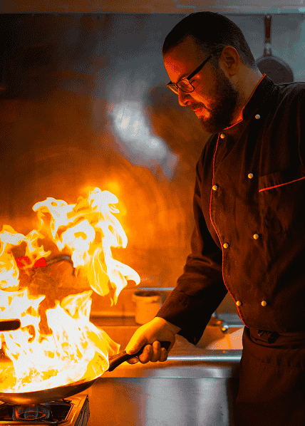 Chef cooking with flames
